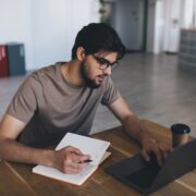 Concentrated man working on laptop