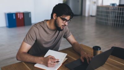 Concentrated man working on laptop
