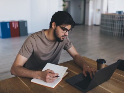 Concentrated man working on laptop